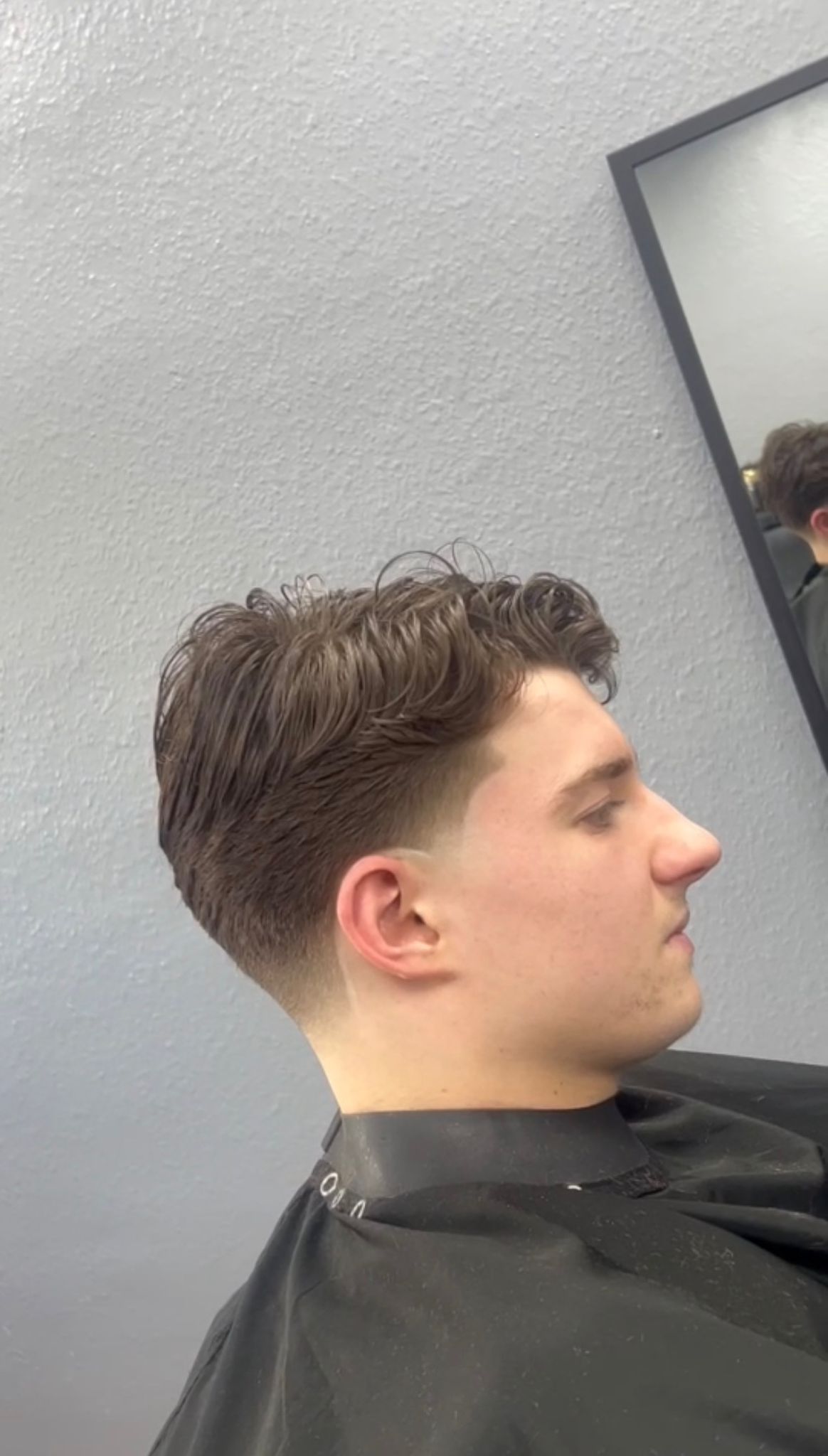 Mid taper haircut side profile